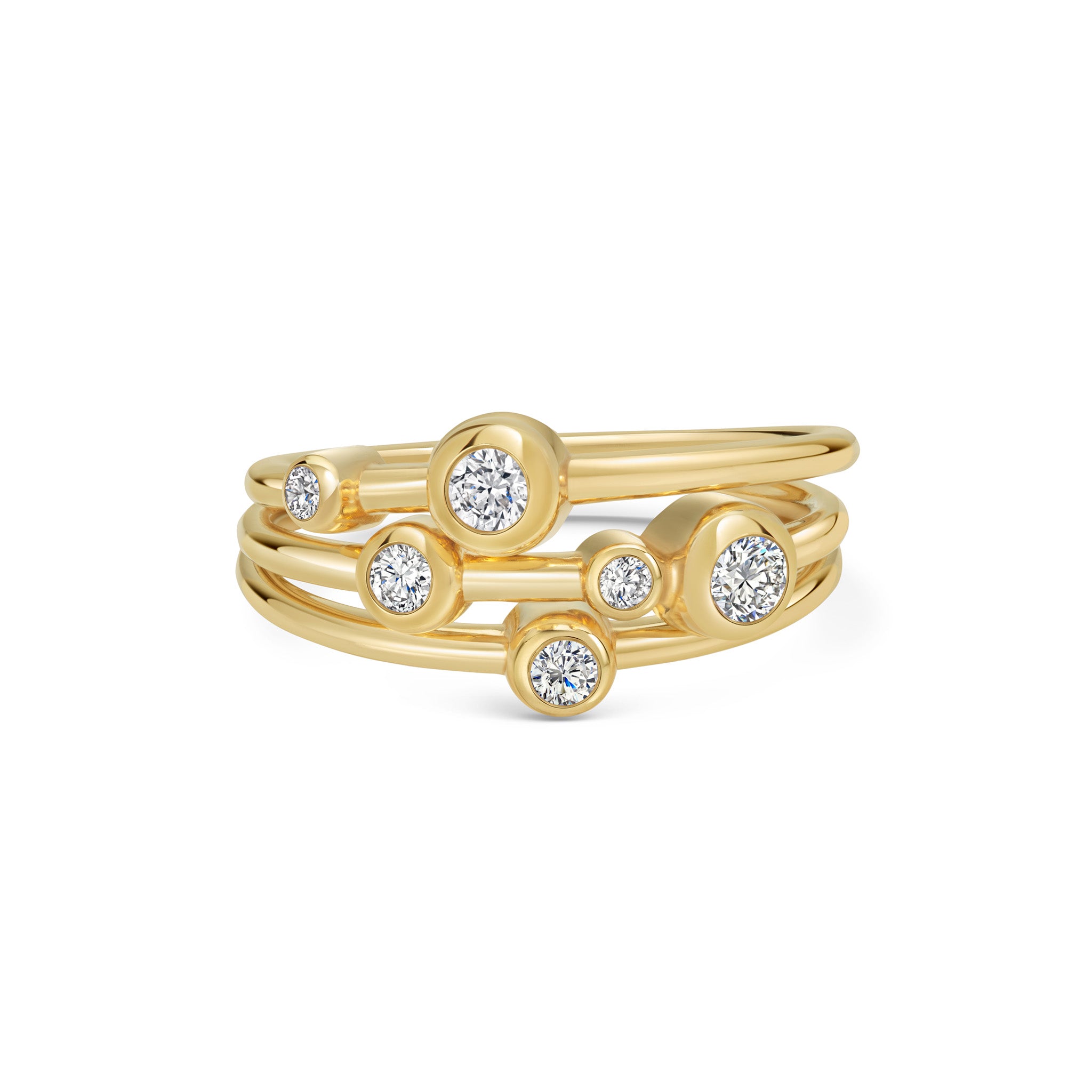 Marina Skia bold and contemporary stack of solitaire rings in white diamond and 18K yellow gold