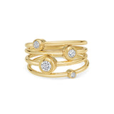 Marina Skia elegant stack of solitaire rings in diamond and 18K yellow gold